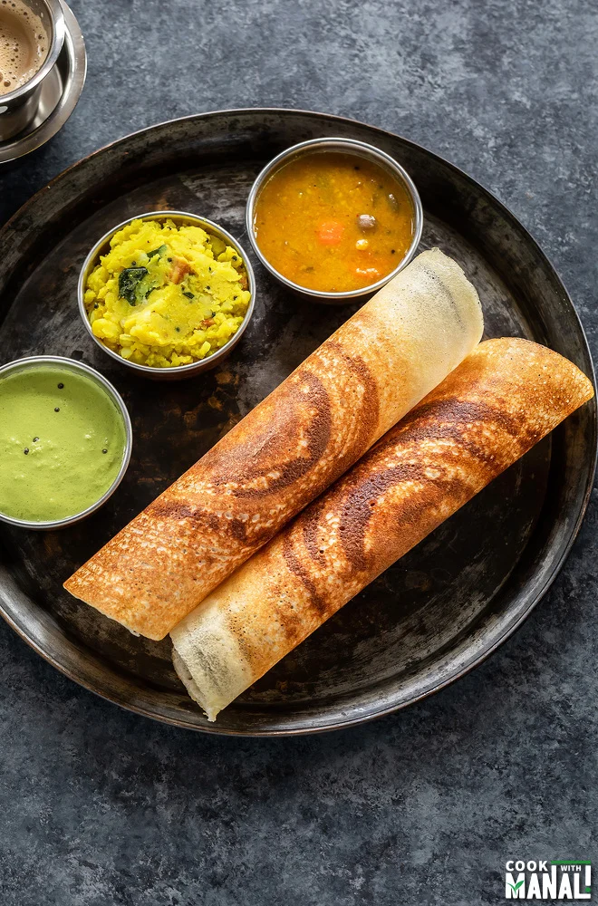 Crispy rolled masala dosa with sambar, coconut chutney, and potato masala